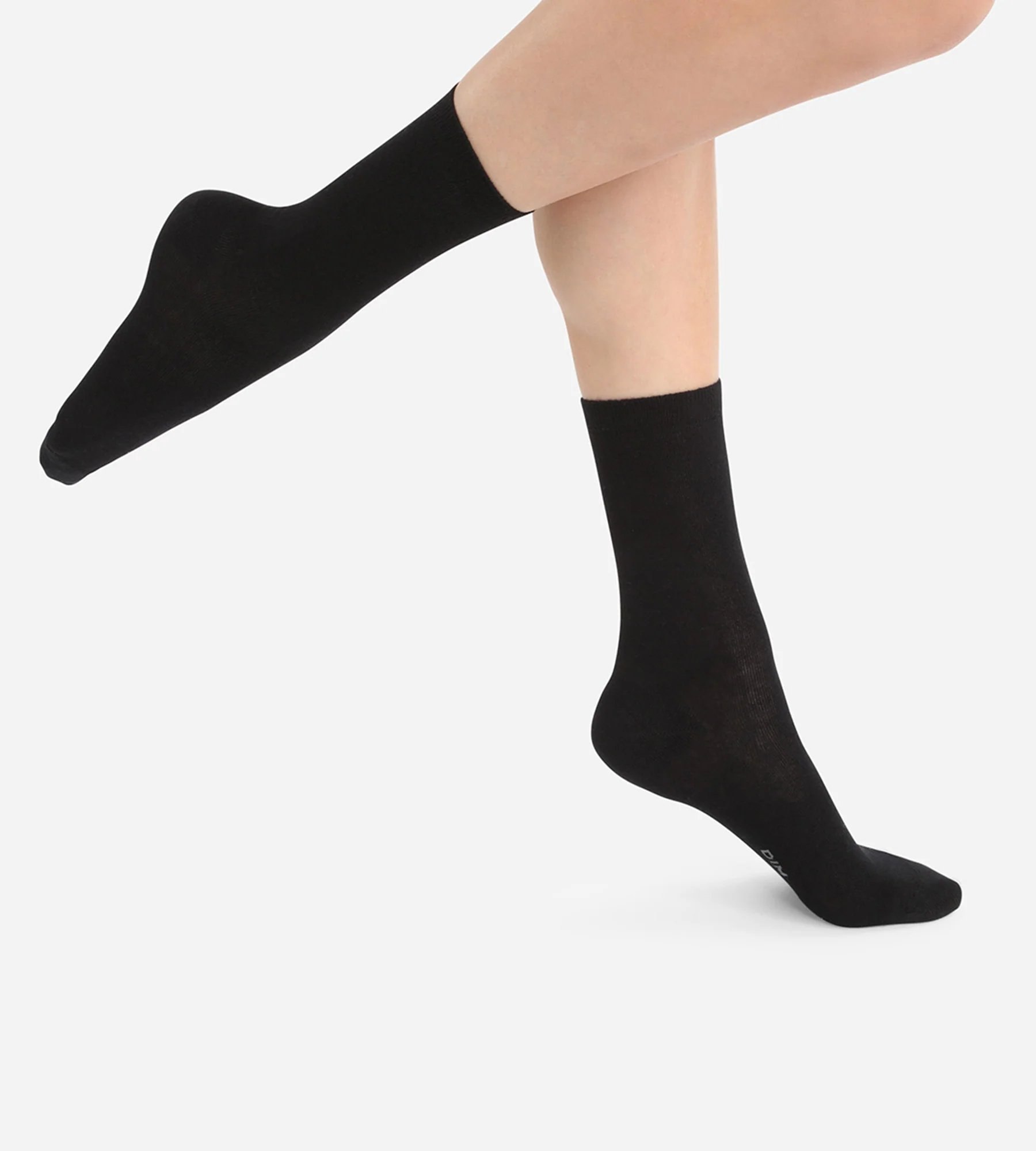 DIM – Chaussettes unies noires en laine douce Femme à 11.99 € chez DIM